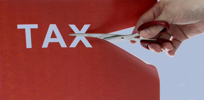 The word tax being cut with scissors