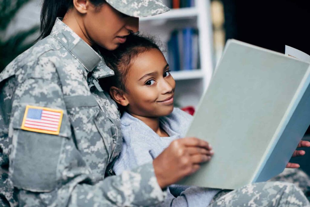 Woman in US military reading to her daughter