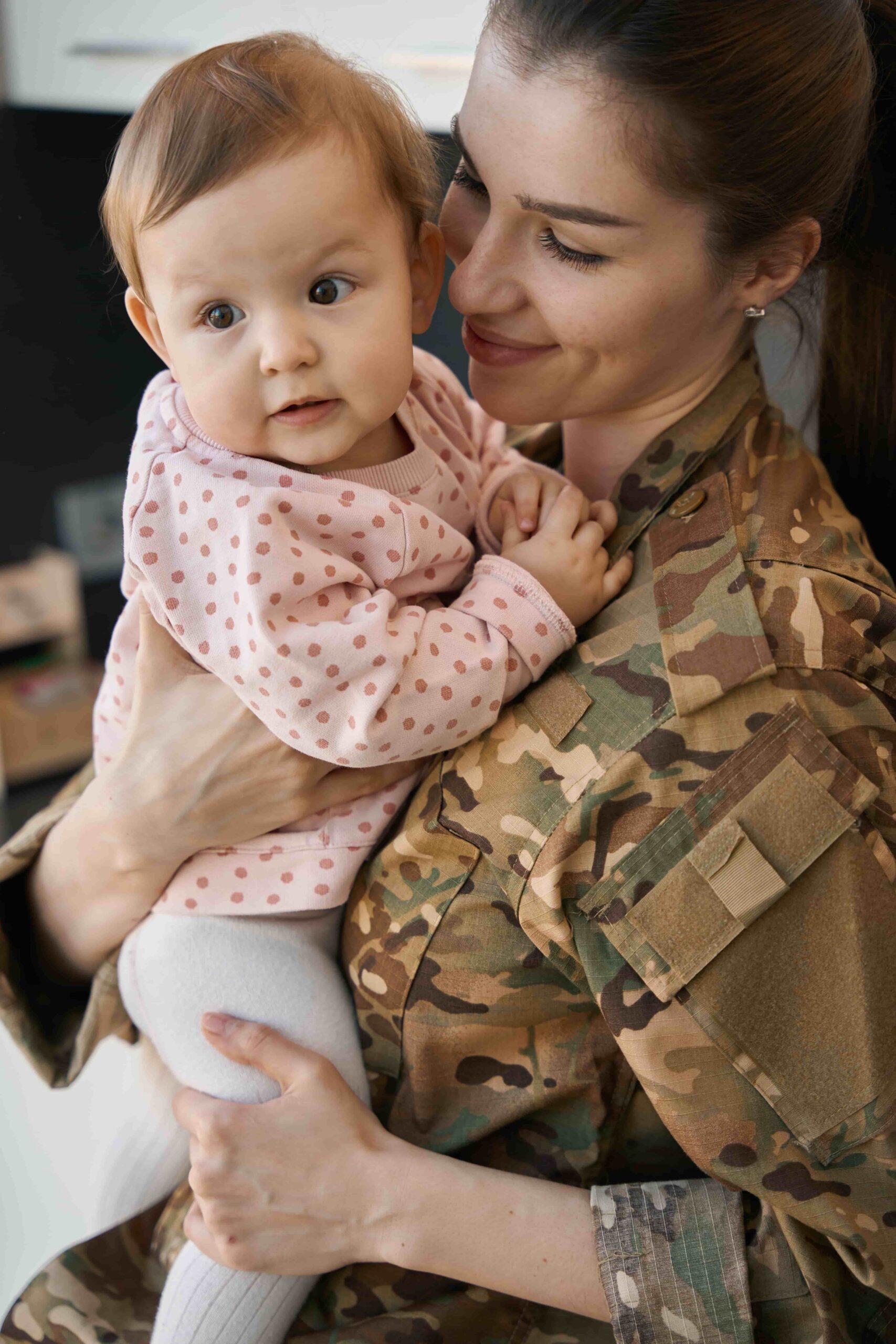 woman-in-military-uniform-holding-adorable-baby
